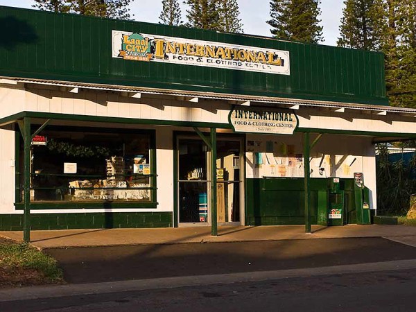a green sign above a store